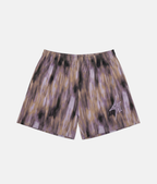 Short de sport 4Handle Brush Fade avec motif texturé à effet de coups de pinceau verticaux violet, beige et noir, et logo 4Handle sur la jambe droite.