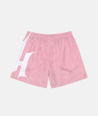 Vue arrière du short de sport 4Handle Just Handle Dune pink, montrant le design texturé continu et le logo blanc enveloppant le côté de la jambe.