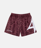Short de sport 4Handle rouge reptile orné d'un imprimé peau de serpent rouge et noir éclatant, de l'inscription cursive just handle et d'un grand logo blanc sur le côté.