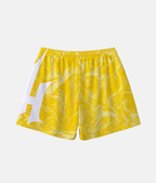 Vue arrière du short de sport 4Handle Smooth yellow, montrant la continuité du motif fluide jaune et le logo blanc enveloppant la jambe.